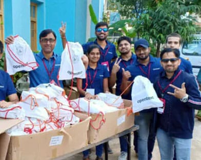 OpenText team in India distributing hygiene kits in the community